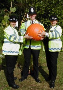 3 policemen and a pumpkin